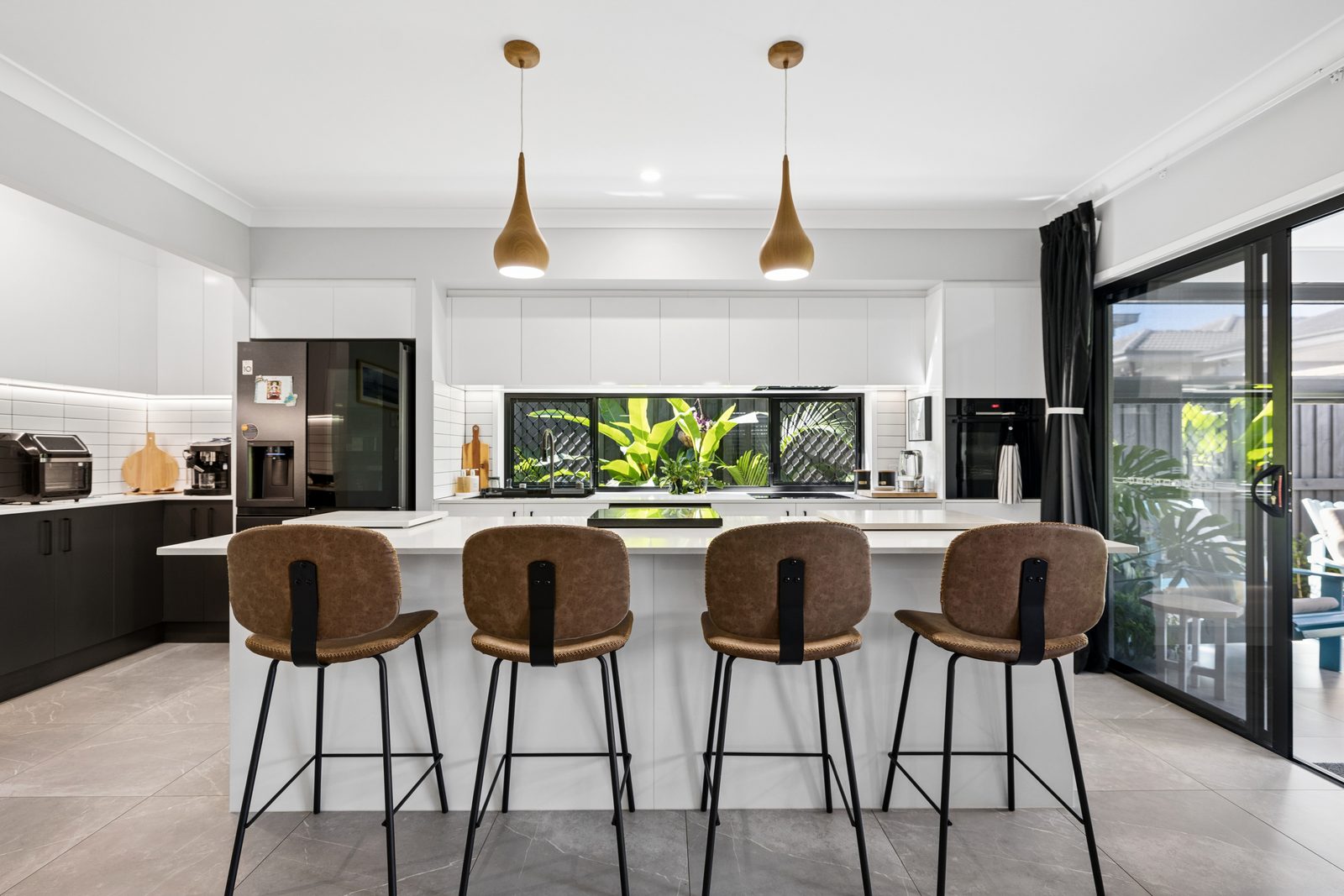 Kitchen with island and pendants