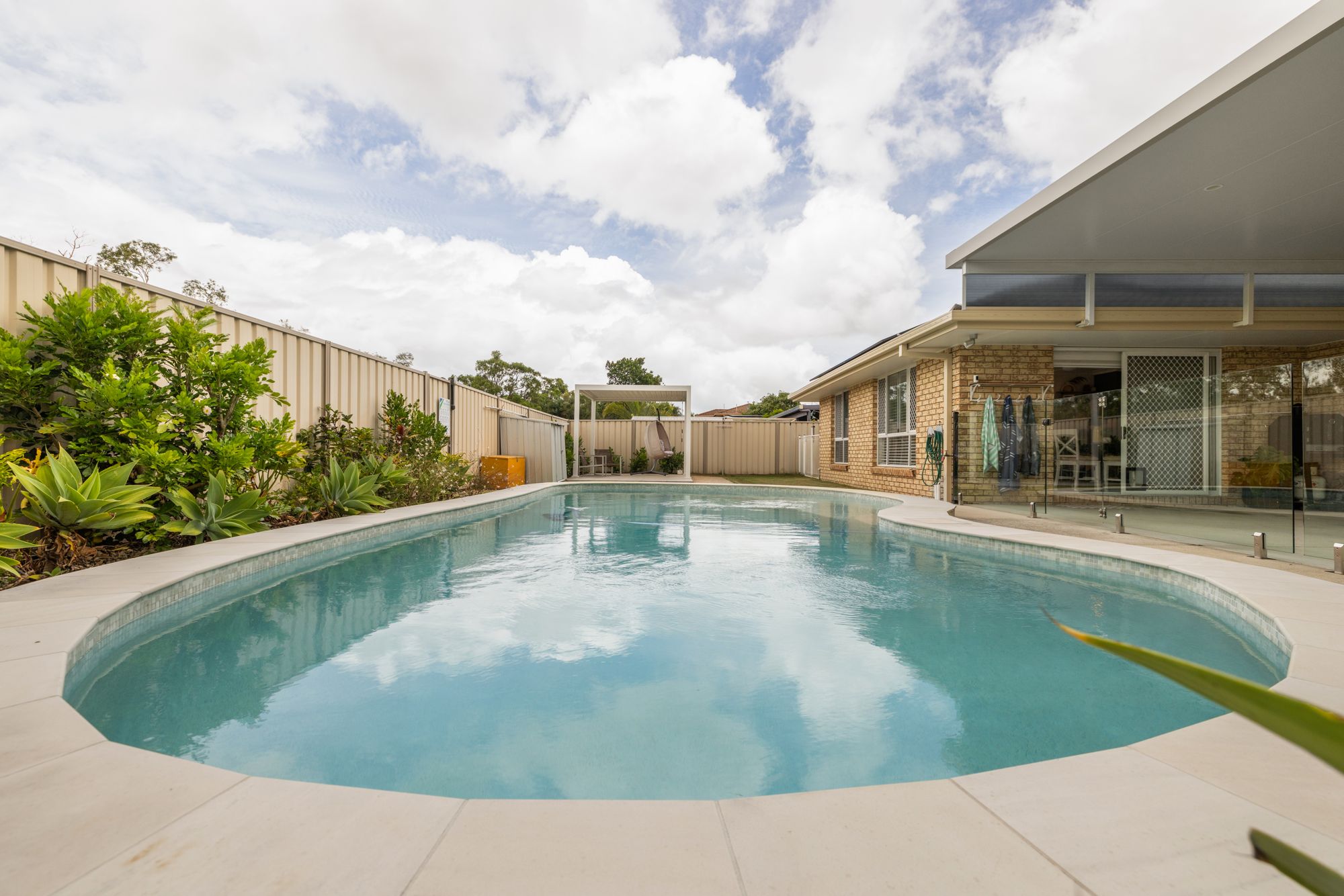 Backyard pool under big sky