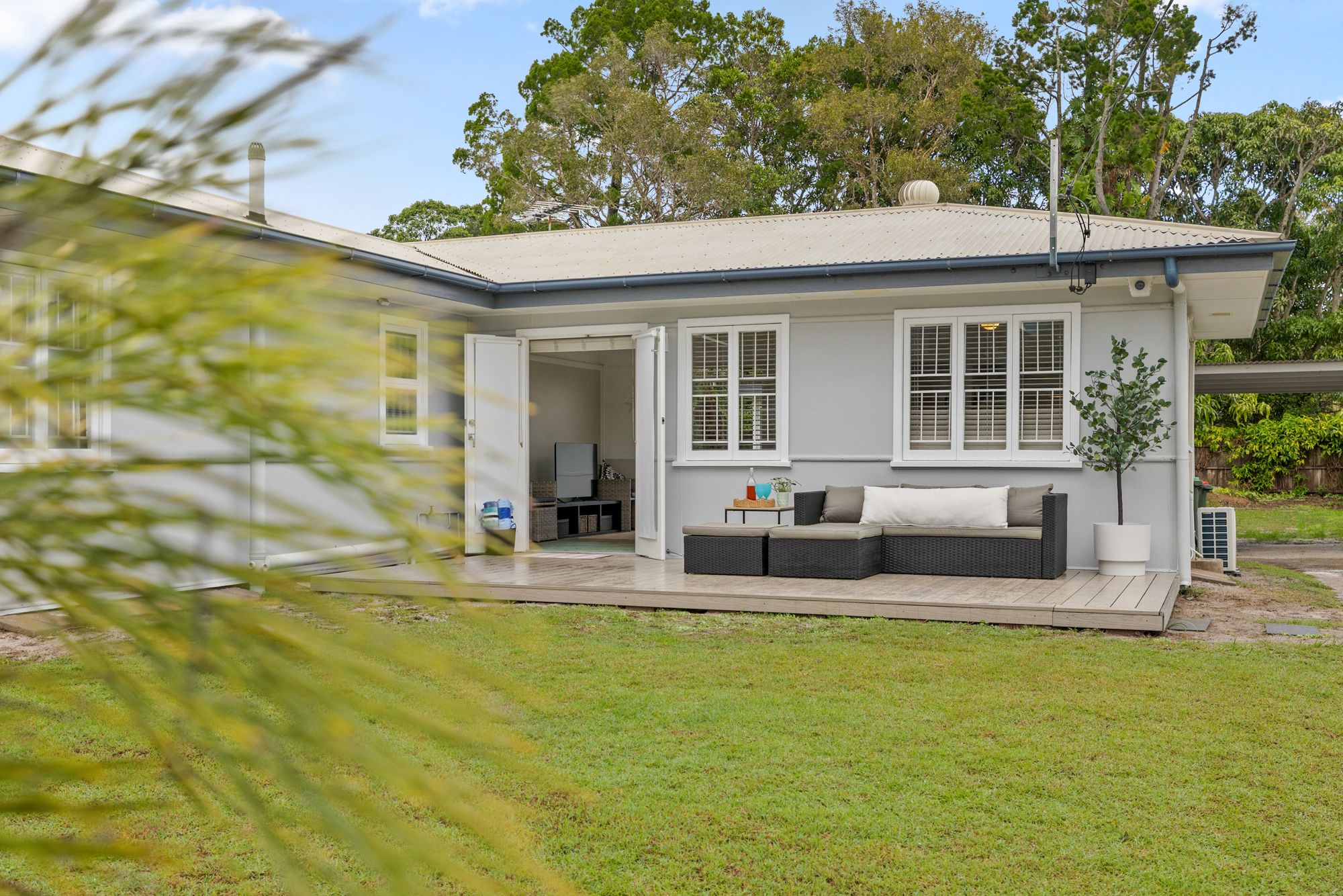White cottage and lawn
