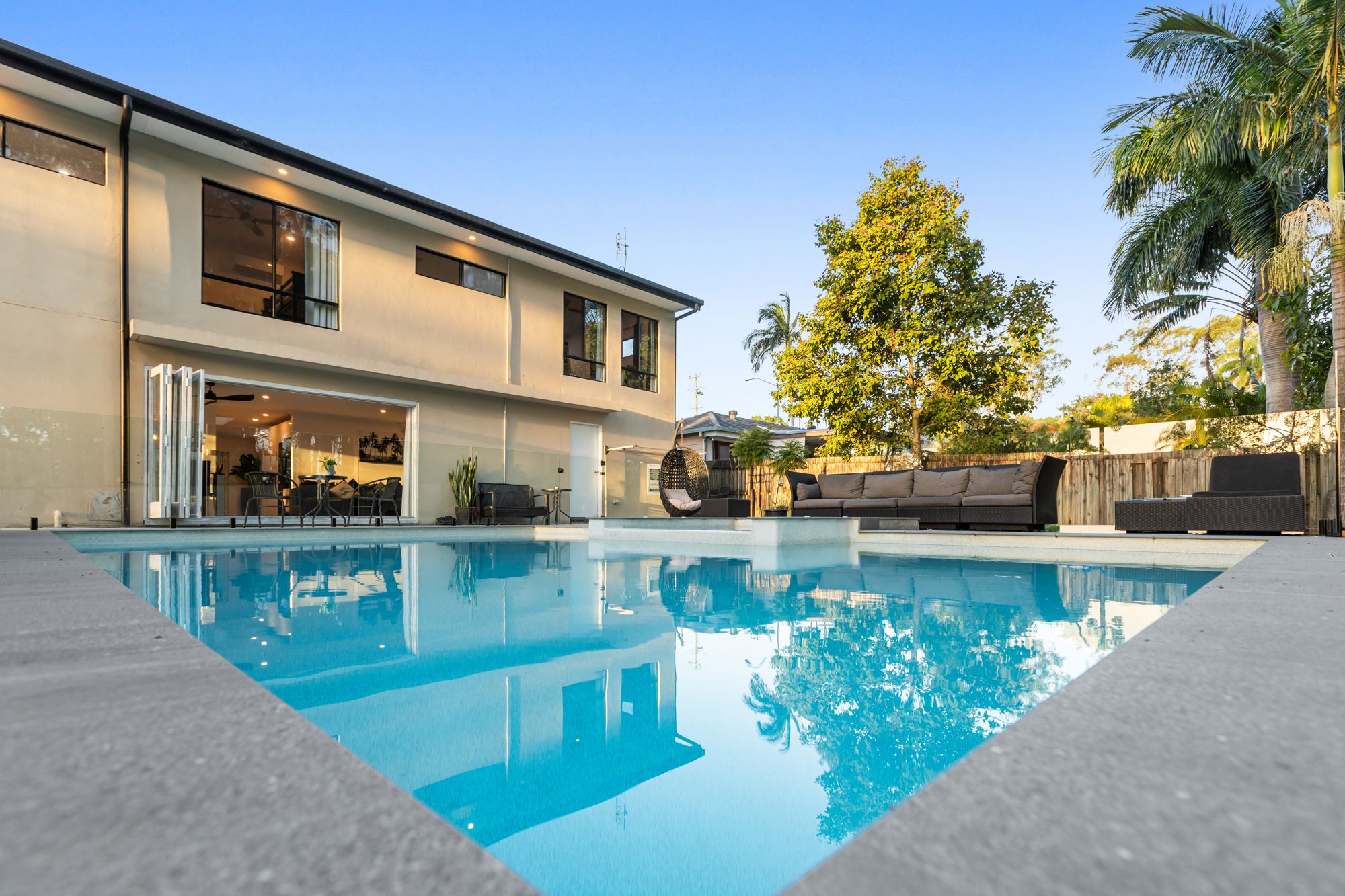 Modern home and pool at dusk