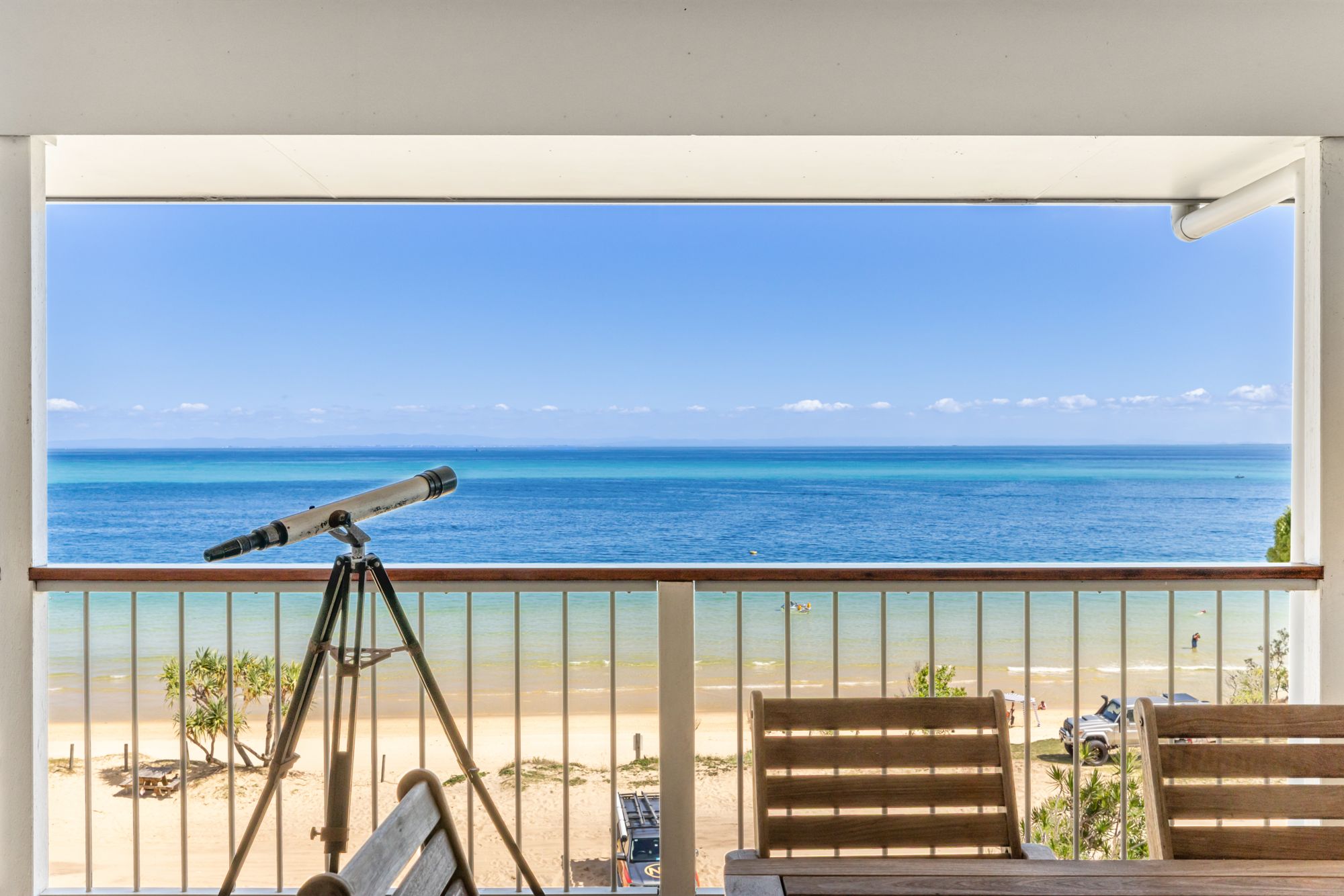 Balcony with telescope and ocean view