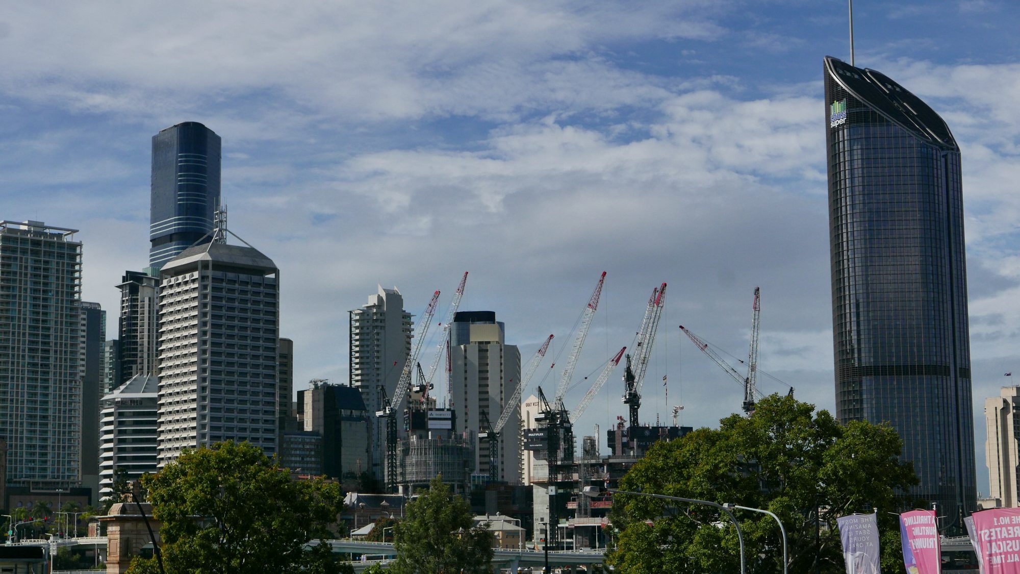 Construction cranes over the Brisbane CBD